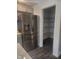 Stainless steel refrigerator next to a walk-in pantry with wire shelving at 1826 N Dexter St, Indianapolis, IN 46202