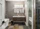 Modern bathroom with double vanity, soaking tub, and walk-in shower at 501 Fletcher Ave # Apt A, Indianapolis, IN 46203