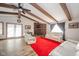 Living room with exposed beams, fireplace, and white sofas at 8762 S State Road 109, Markleville, IN 46056