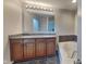 Bathroom features double vanity, granite countertop, and a bathtub at 9558 Oakley Dr, Indianapolis, IN 46260