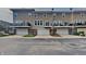 Three-unit townhouse building with private balconies and attached garages at 9558 Oakley Dr, Indianapolis, IN 46260