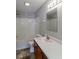 Simple bathroom with tiled walls, a single vanity, and a bathtub/shower combination at 10938 Delphi Dr, Camby, IN 46113