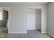 Empty bedroom with a closet and doorway leading to another room at 10938 Delphi Dr, Camby, IN 46113