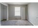 Empty bedroom with carpet, closet, and window at 10938 Delphi Dr, Camby, IN 46113