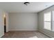 Spacious bedroom with plush carpeting, large windows, and neutral paint at 10938 Delphi Dr, Camby, IN 46113