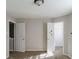 Empty bedroom with open doors leading to a closet and another room at 10938 Delphi Dr, Camby, IN 46113