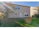 Backyard view of two-story home with patio and grassy lawn at 10938 Delphi Dr, Camby, IN 46113