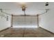 Spacious garage with a large door and concrete flooring at 10938 Delphi Dr, Camby, IN 46113
