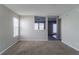 Spacious living room with neutral walls and carpeted flooring at 10938 Delphi Dr, Camby, IN 46113