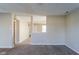 Empty living room with neutral gray walls and plush carpeting at 10938 Delphi Dr, Camby, IN 46113
