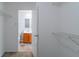 Walk-in closet with wire shelving and a view into an adjacent bathroom at 10938 Delphi Dr, Camby, IN 46113