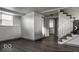 Finished basement with wood-look floors and staircase at 4276 Mission Dr, Indianapolis, IN 46254