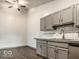 Modern kitchen with gray cabinets and wood-look floors at 4276 Mission Dr, Indianapolis, IN 46254