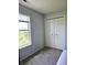 Well-lit bedroom with gray walls and a large closet at 5236 Bluff View Dr, Indianapolis, IN 46217