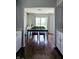 Bright dining room with backyard view and dark hardwood floors at 5236 Bluff View Dr, Indianapolis, IN 46217