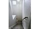 Gray carpeted stairs with wooden handrail at 5236 Bluff View Dr, Indianapolis, IN 46217