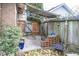 Small backyard patio with pergola and brick fire pit at 1330 N Bosart Ave, Indianapolis, IN 46201