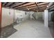 Unfinished basement with laundry hookups and ample storage space at 1330 N Bosart Ave, Indianapolis, IN 46201