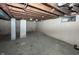 Unfinished basement with concrete floor and exposed beams at 1330 N Bosart Ave, Indianapolis, IN 46201
