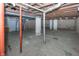Unfinished basement with exposed pipes and support beams at 1330 N Bosart Ave, Indianapolis, IN 46201