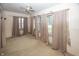 Bedroom with three windows and beige curtains at 1330 N Bosart Ave, Indianapolis, IN 46201