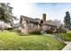 Brick house with a well-manicured lawn and walkway at 1330 N Bosart Ave, Indianapolis, IN 46201