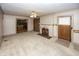 Living room with fireplace and view into kitchen at 1330 N Bosart Ave, Indianapolis, IN 46201