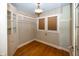 Small office space with wood floors and built-in shelving at 1330 N Bosart Ave, Indianapolis, IN 46201