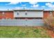Landscaped lawn with a fenced backyard and gray fence at 1709 Queensbridge Dr, Indianapolis, IN 46219