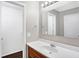 Bathroom with single sink vanity, mirror, and shower at 1709 Queensbridge Dr, Indianapolis, IN 46219