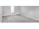 Simple bedroom with gray walls, gray carpet, and one window at 1709 Queensbridge Dr, Indianapolis, IN 46219
