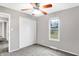 Bedroom with ceiling fan, carpet, and closet at 1709 Queensbridge Dr, Indianapolis, IN 46219