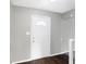 Front entry with white door, dark hardwood floor, and neutral walls at 1709 Queensbridge Dr, Indianapolis, IN 46219