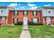 Brick front exterior of a townhome with well-manicured lawn at 1709 Queensbridge Dr, Indianapolis, IN 46219