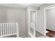 Upper hallway with gray carpeting and white railings at 1709 Queensbridge Dr, Indianapolis, IN 46219