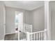 Upper hallway with gray carpeting and white railings at 1709 Queensbridge Dr, Indianapolis, IN 46219