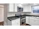 Stainless steel appliances and white cabinetry in a galley kitchen at 1709 Queensbridge Dr, Indianapolis, IN 46219
