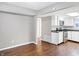 View of kitchen with white cabinets, dark countertops, and stainless steel appliances at 1709 Queensbridge Dr, Indianapolis, IN 46219