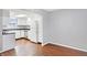Kitchen with white cabinets, stainless steel appliances, and dark floors at 1709 Queensbridge Dr, Indianapolis, IN 46219