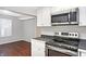 Modern kitchen features stainless steel appliances and dark countertops at 1709 Queensbridge Dr, Indianapolis, IN 46219