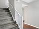 Gray carpeting covers the stairs with a white railing at 1709 Queensbridge Dr, Indianapolis, IN 46219