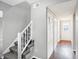 Gray carpeting on stairs with white railing leading to upper level at 1709 Queensbridge Dr, Indianapolis, IN 46219