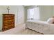 Light-filled bedroom with twin bed, dresser, and double door closet at 18445 Piers End Dr, Noblesville, IN 46062