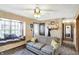 Living room with a sofa, window seat, and view into hallway at 5 Woodridge Ct, Whiteland, IN 46184