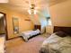 Shared bedroom with twin beds, dresser, and access to a hallway at 7919 W County Road 100 South, Coatesville, IN 46121