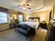 Spacious primary bedroom with king-size bed and en-suite bathroom at 7919 W County Road 100 South, Coatesville, IN 46121
