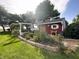 Landscaped garden with red garden barn at 7919 W County Road 100 South, Coatesville, IN 46121
