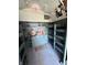 Bunk beds and storage cabinets in a charming storage room at 7919 W County Road 100 South, Coatesville, IN 46121