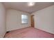 Simple bedroom with pink carpet and a window at 80 S Mickley Ave, Indianapolis, IN 46241