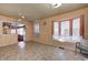 Simple dining area with tile floor and built in window seat at 80 S Mickley Ave, Indianapolis, IN 46241